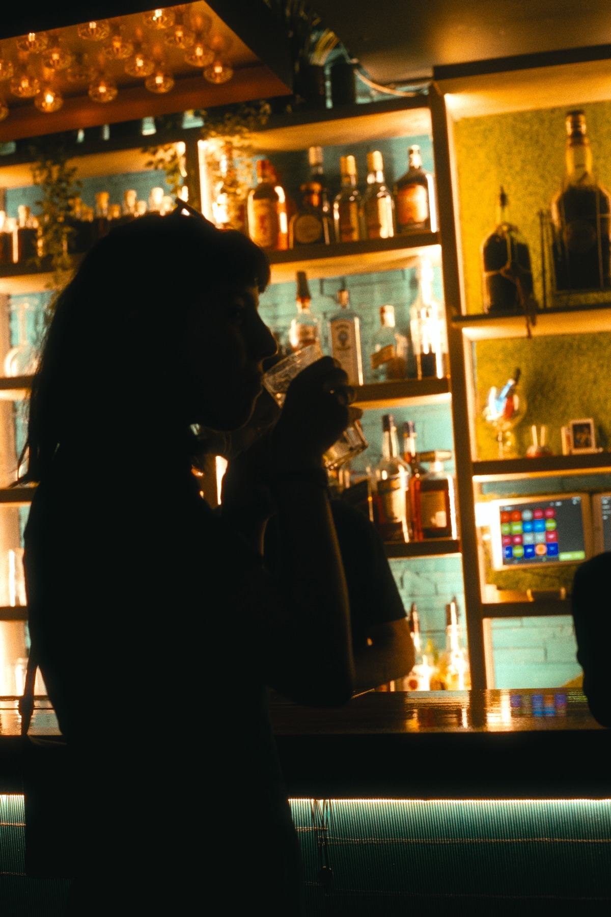 A guest having a drink at the Copas bar